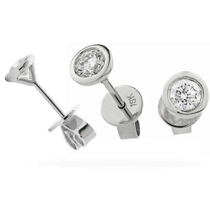 ROUND BRILLIANT SOLITAIRE EARRINGS IN RUB OVER SETTING 18K WHITE GOLD - HEERA DIAMONDS